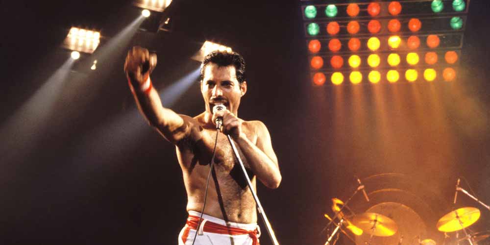 Freddie Mercury singing without his shirt on
